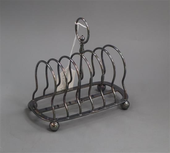 A Victorian silver seven bar toast rack, John Edward Bingham, Sheffield, 1887, 10.5 oz.